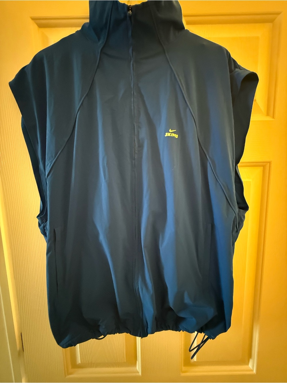 SKIMS Navy Blue Sleeveless Zip-Up Vest with Yellow Logo